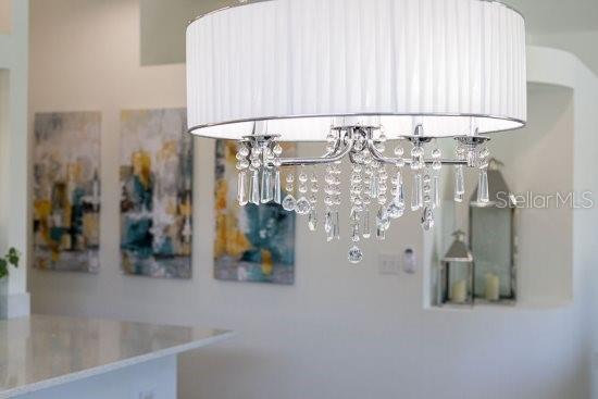 2908 Sunset Lakes Blvd, Kissimmee, FL 34747 - detailed view of water heater and a chandelier
