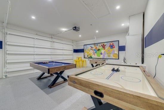 2908 Sunset Lakes Blvd, Kissimmee, FL 34747 - recreation room featuring recessed lighting and attic access