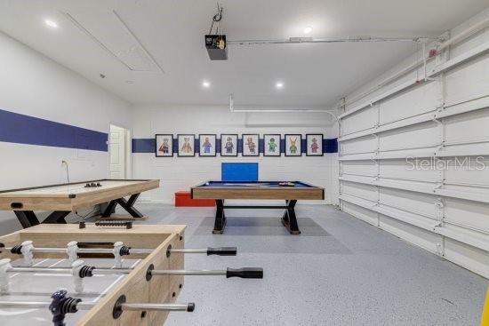2908 Sunset Lakes Blvd, Kissimmee, FL 34747 - playroom with speckle patterned floor, recessed lighting, and billiards table