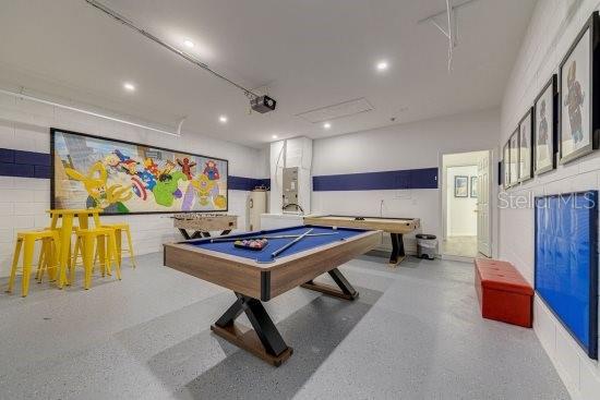2908 Sunset Lakes Blvd, Kissimmee, FL 34747 - recreation room with billiards table, recessed lighting, and speckle patterned floor