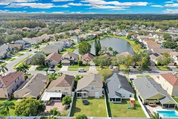 721 Hardwood Cir, Orlando, FL 32828 - aerial perspective of suburban area featuring a large body of water