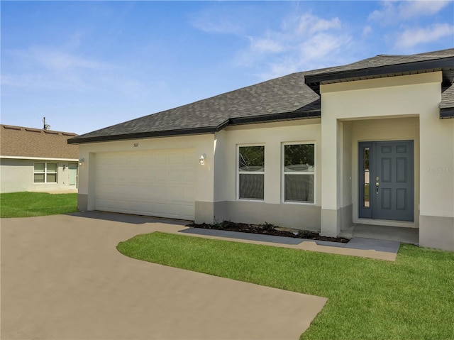 502 Viceroy Ct, Kissimmee, FL 34758 - view of front facade with concrete driveway, stucco siding, and a garage