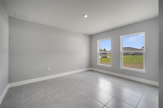 502 Viceroy Ct, Kissimmee, FL 34758 - tiled spare room featuring baseboards and recessed lighting