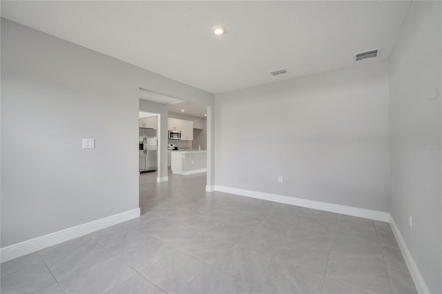 502 Viceroy Ct, Kissimmee, FL 34758 - unfurnished room featuring recessed lighting, light tile patterned flooring, and baseboards