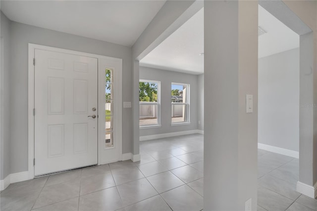 502 Viceroy Ct, Kissimmee, FL 34758 - foyer featuring baseboards and light tile patterned floors