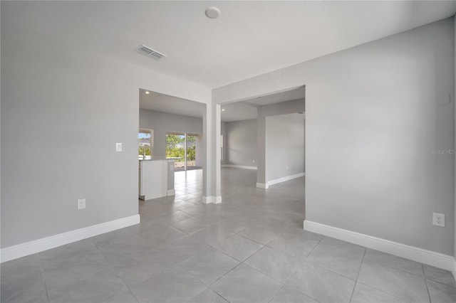 502 Viceroy Ct, Kissimmee, FL 34758 - empty room with baseboards and light tile patterned flooring