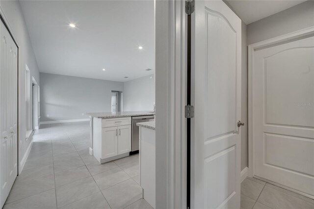 502 Viceroy Ct, Kissimmee, FL 34758 - hallway with light tile patterned flooring, baseboards, and recessed lighting