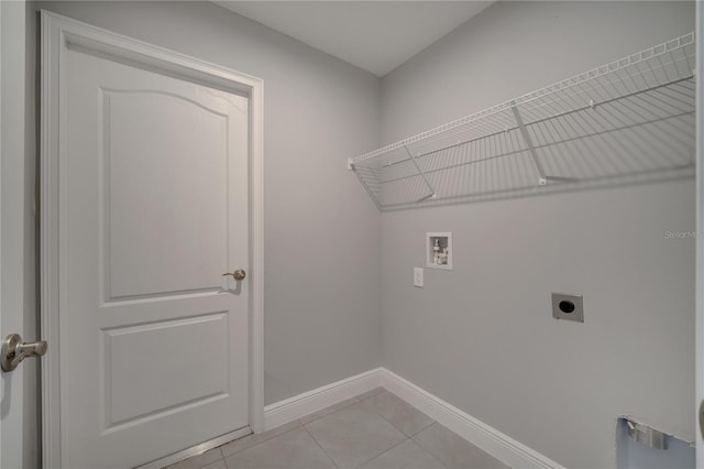 502 Viceroy Ct, Kissimmee, FL 34758 - washroom with electric dryer hookup, washer hookup, baseboards, and light tile patterned floors