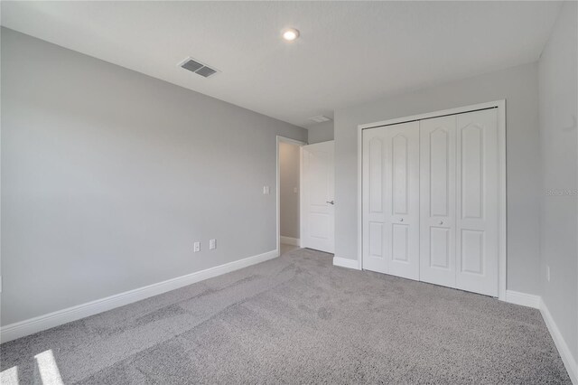 502 Viceroy Ct, Kissimmee, FL 34758 - unfurnished bedroom featuring carpet floors, baseboards, a closet, and recessed lighting
