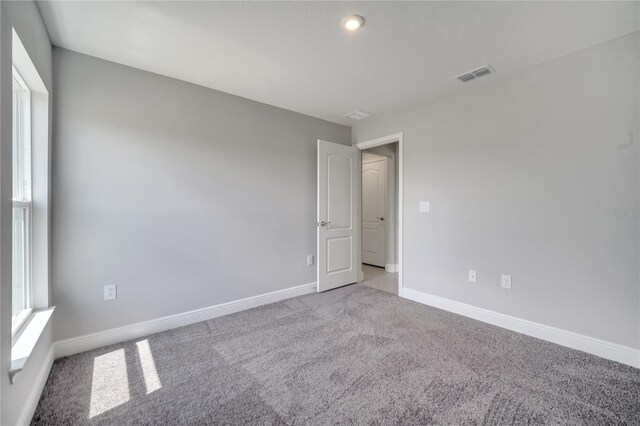 502 Viceroy Ct, Kissimmee, FL 34758 - empty room featuring carpet and baseboards