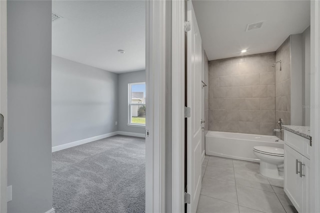 502 Viceroy Ct, Kissimmee, FL 34758 - full bath with toilet, bathtub / shower combination, tile patterned flooring, baseboards, and vanity
