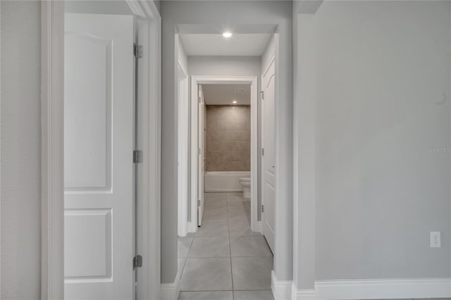 502 Viceroy Ct, Kissimmee, FL 34758 - hallway featuring light tile patterned flooring and baseboards