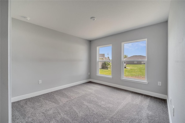 502 Viceroy Ct, Kissimmee, FL 34758 - spare room featuring carpet floors, baseboards, and a smoke detector