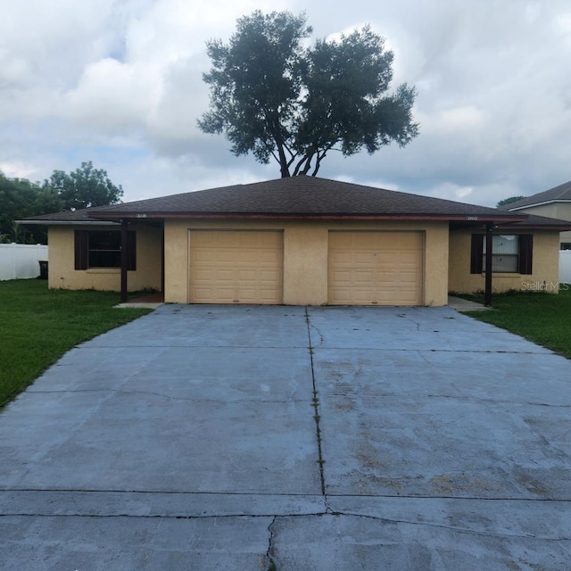 366-368 Dundee Dr, Kissimmee, FL 34759 - view of front of house with an attached garage, driveway, and stucco siding