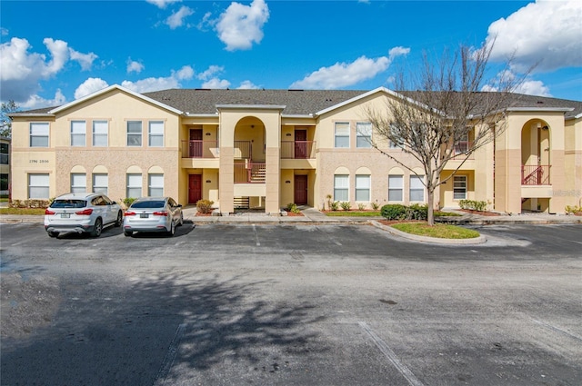 2798 Club Cortile Cir Unit A, Kissimmee, FL 34746 - multi unit property featuring stucco siding and uncovered parking