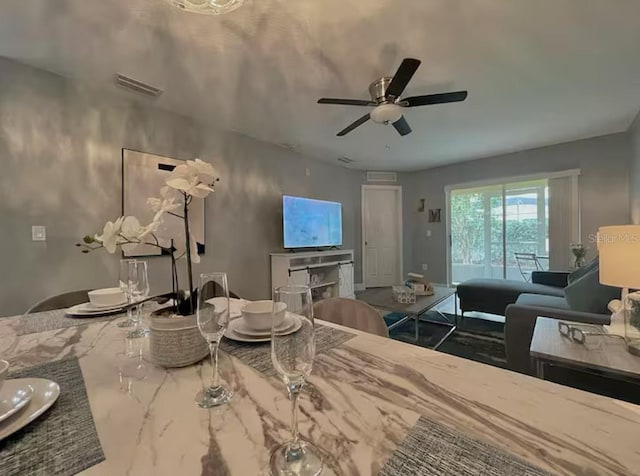 2798 Club Cortile Cir Unit A, Kissimmee, FL 34746 - dining space with a ceiling fan and marble finish flooring