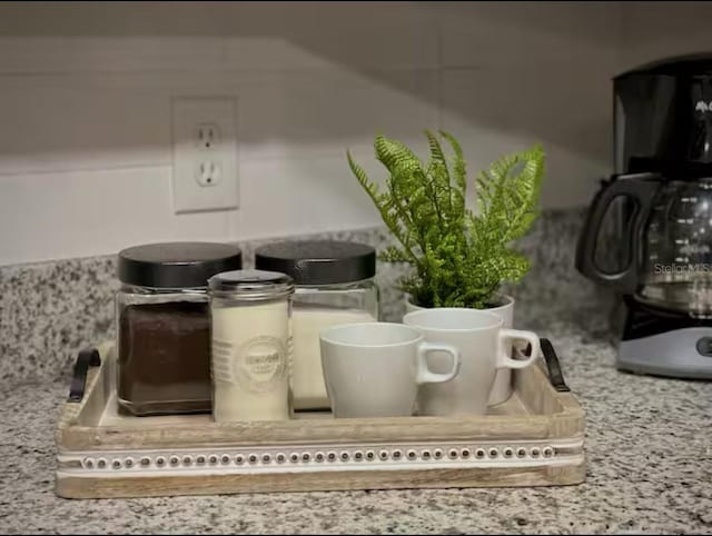 2798 Club Cortile Cir Unit A, Kissimmee, FL 34746 - kitchen view of light stone countertops