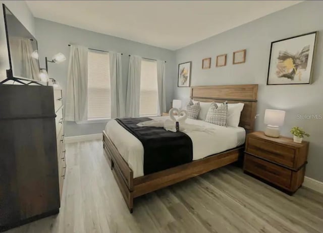 2798 Club Cortile Cir Unit A, Kissimmee, FL 34746 - bedroom featuring light wood finished floors and baseboards