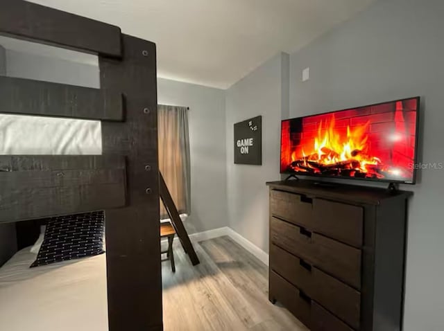 2798 Club Cortile Cir Unit A, Kissimmee, FL 34746 - bedroom with light wood-style floors and baseboards