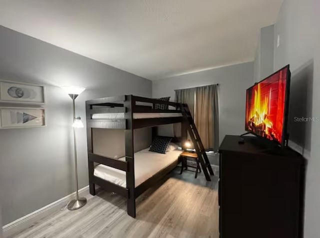 2798 Club Cortile Cir Unit A, Kissimmee, FL 34746 - bedroom featuring wood finished floors and baseboards