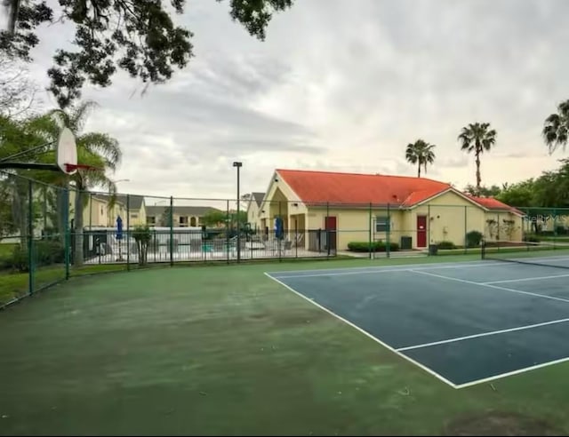 2798 Club Cortile Cir Unit A, Kissimmee, FL 34746 - view of tennis court with fence and community basketball court