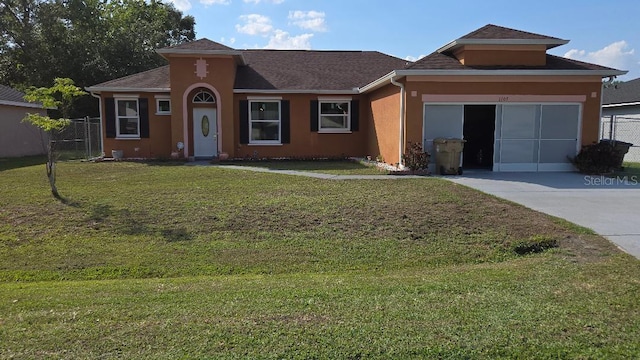 1107 Dartford Dr, Kissimmee, FL 34758 - view of front of house with stucco siding and driveway
