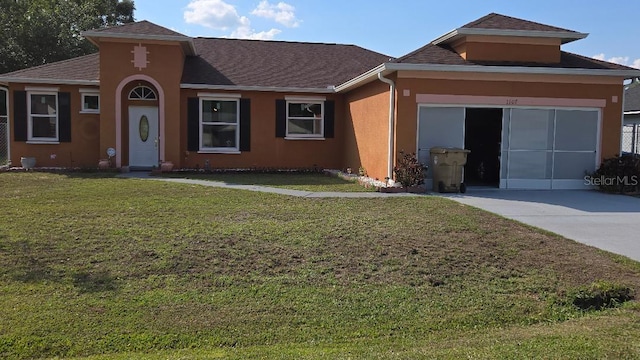 1107 Dartford Dr, Kissimmee, FL 34758 - view of front of property with stucco siding, a front yard, and roof with shingles