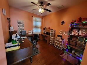 1107 Dartford Dr, Kissimmee, FL 34758 - office area featuring a ceiling fan and wood finished floors