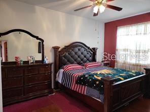 1107 Dartford Dr, Kissimmee, FL 34758 - bedroom featuring a ceiling fan