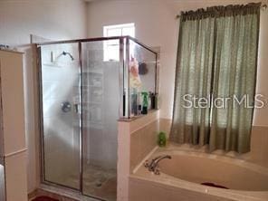 1107 Dartford Dr, Kissimmee, FL 34758 - full bath with a bath and a shower stall