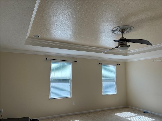 3003 Cobham Rd, Kissimmee, FL 34758 - unfurnished room with a tray ceiling, a textured ceiling, ornamental molding, and a ceiling fan