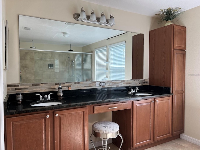 3003 Cobham Rd, Kissimmee, FL 34758 - full bathroom with backsplash, a shower stall, and double vanity