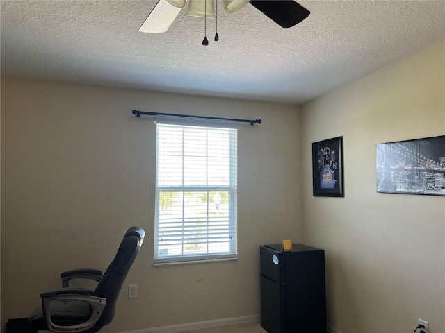 3003 Cobham Rd, Kissimmee, FL 34758 - home office with plenty of natural light, a textured ceiling, a ceiling fan, and baseboards