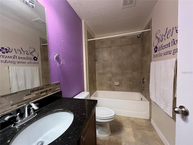 3003 Cobham Rd, Kissimmee, FL 34758 - bathroom with toilet, a textured ceiling, vanity, and shower / bath combination