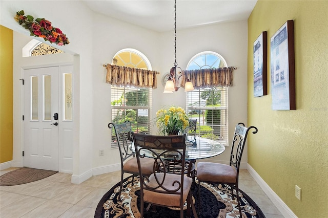 1258 Donalds Pl, The Villages, FL 32162 - dining room featuring light tile patterned flooring, a chandelier, and baseboards