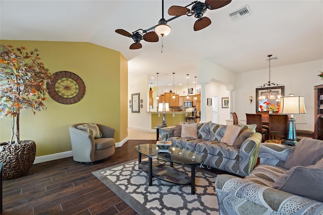 1258 Donalds Pl, The Villages, FL 32162 - living room featuring ceiling fan, dark wood-style flooring, ornate columns, and baseboards