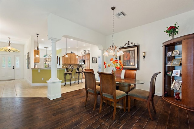 1258 Donalds Pl, The Villages, FL 32162 - dining space with wood finished floors, decorative columns, baseboards, and recessed lighting