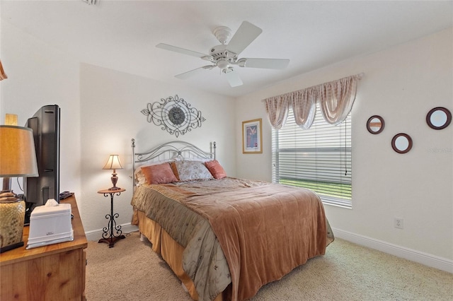 1258 Donalds Pl, The Villages, FL 32162 - bedroom featuring light colored carpet, baseboards, and a ceiling fan