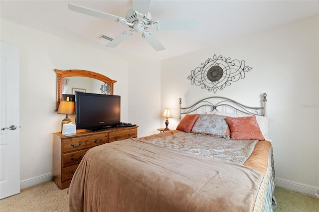 1258 Donalds Pl, The Villages, FL 32162 - bedroom featuring light colored carpet, baseboards, and a ceiling fan