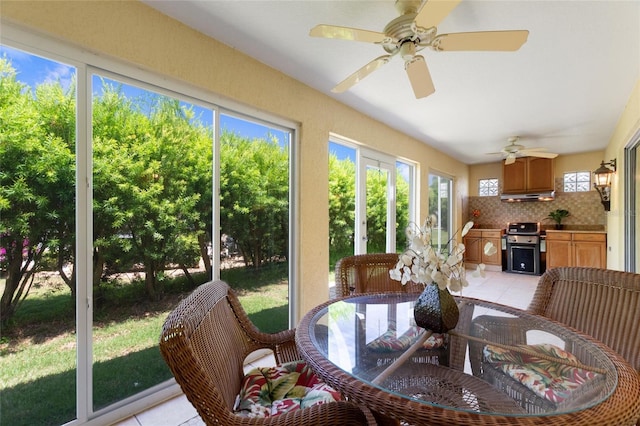 1258 Donalds Pl, The Villages, FL 32162 - sunroom featuring ceiling fan, area for grilling, and outdoor dining space