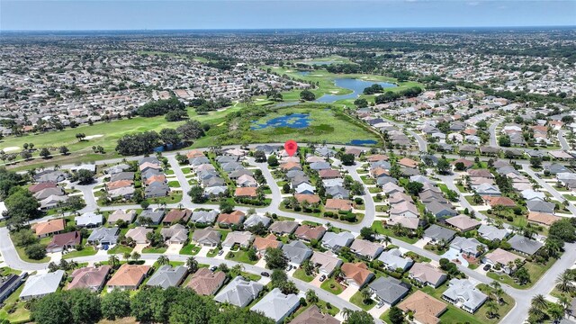 1258 Donalds Pl, The Villages, FL 32162 - aerial view of property's location with a large body of water, nearby suburban area, and a local golf course