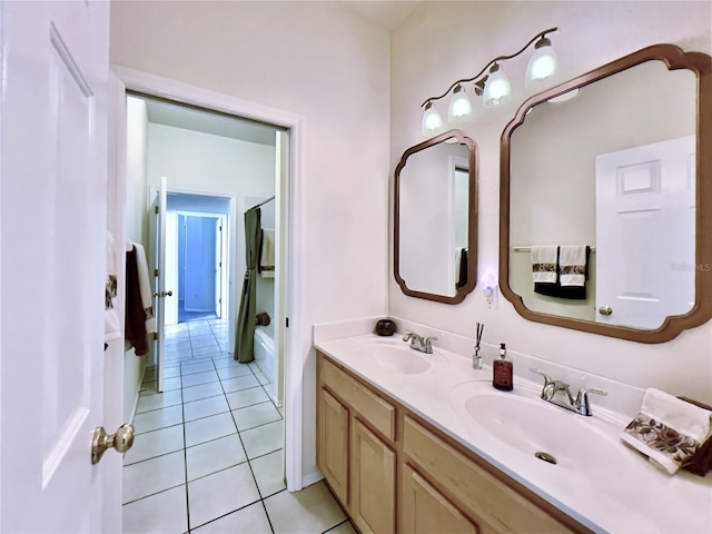 full bath with tile patterned flooring and double vanity