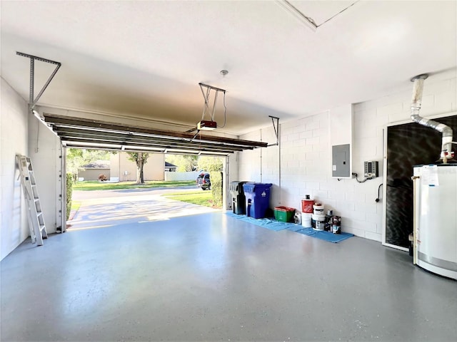garage with electric panel, water heater, a garage door opener, and concrete block wall