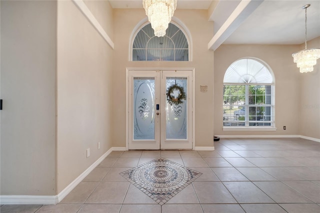 3211 Countryside View Dr, Saint Cloud, FL 34772 - tiled entrance foyer featuring a chandelier, french doors, and baseboards