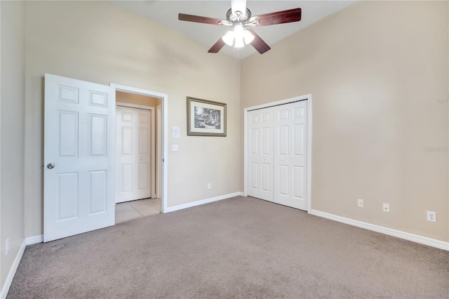 3211 Countryside View Dr, Saint Cloud, FL 34772 - unfurnished bedroom featuring carpet, baseboards, a closet, a towering ceiling, and ceiling fan