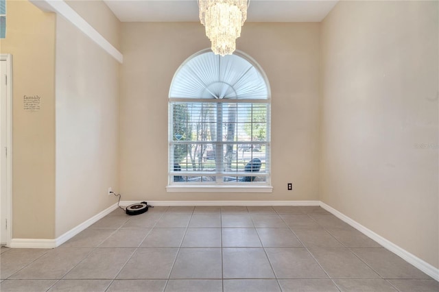 3211 Countryside View Dr, Saint Cloud, FL 34772 - spare room featuring a chandelier, tile patterned flooring, and baseboards