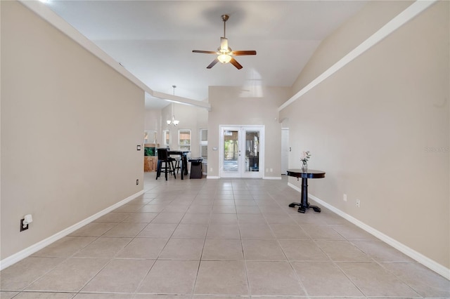3211 Countryside View Dr, Saint Cloud, FL 34772 - spare room with a ceiling fan, light tile patterned flooring, french doors, baseboards, and high vaulted ceiling