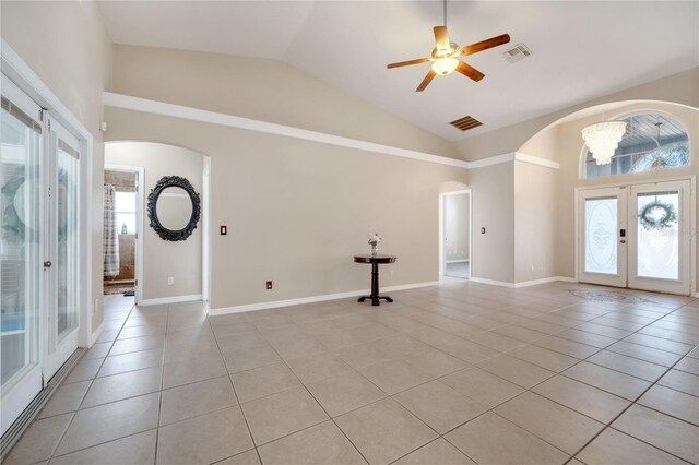 3211 Countryside View Dr, Saint Cloud, FL 34772 - entrance foyer with french doors, arched walkways, light tile patterned flooring, a ceiling fan, and a chandelier