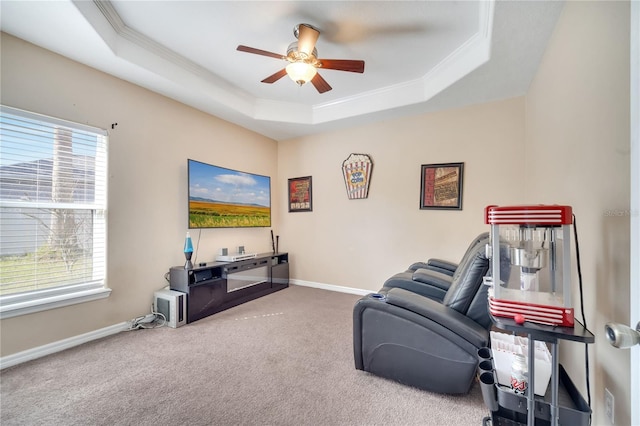 3211 Countryside View Dr, Saint Cloud, FL 34772 - sitting room with crown molding, carpet floors, ceiling fan, a tray ceiling, and healthy amount of natural light