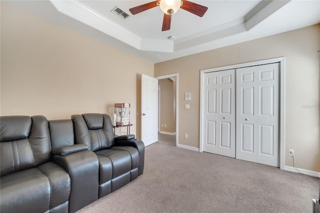 3211 Countryside View Dr, Saint Cloud, FL 34772 - cinema room featuring a ceiling fan, ornamental molding, a raised ceiling, carpet, and baseboards
